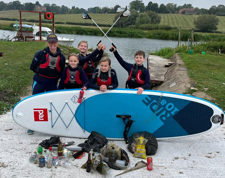 Litter picking on river Avon with paddleboards