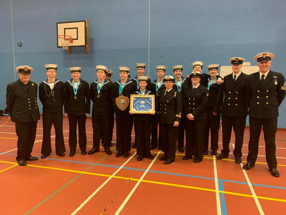 Drill and piping team presented with best unit in district trophy.